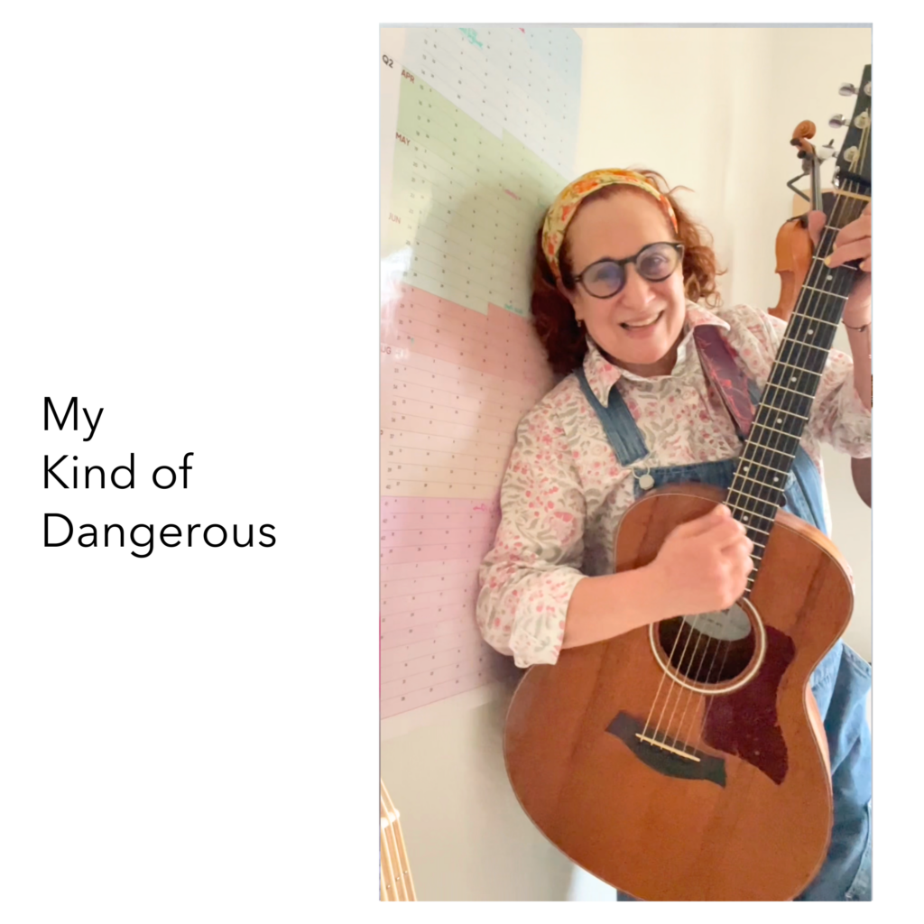 song covert art with smiling woman with guitar leaning against colorful wall My Kind of Dangerous typography